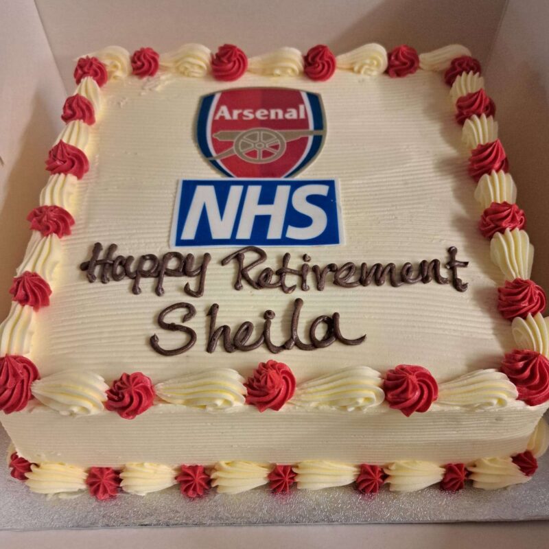 White cake with Arsenal photo