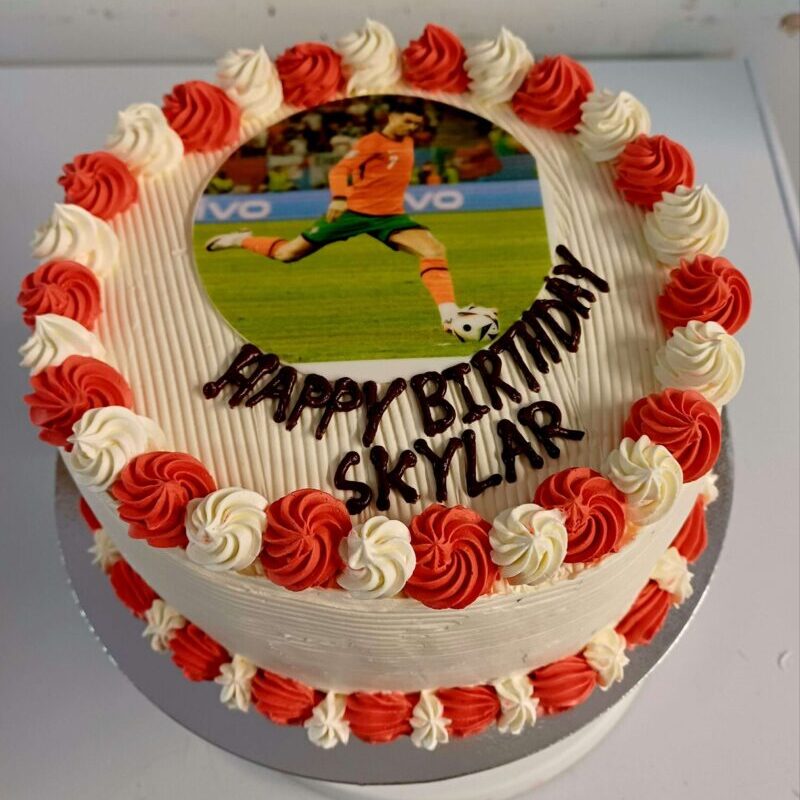 Photo cake with colours piping.