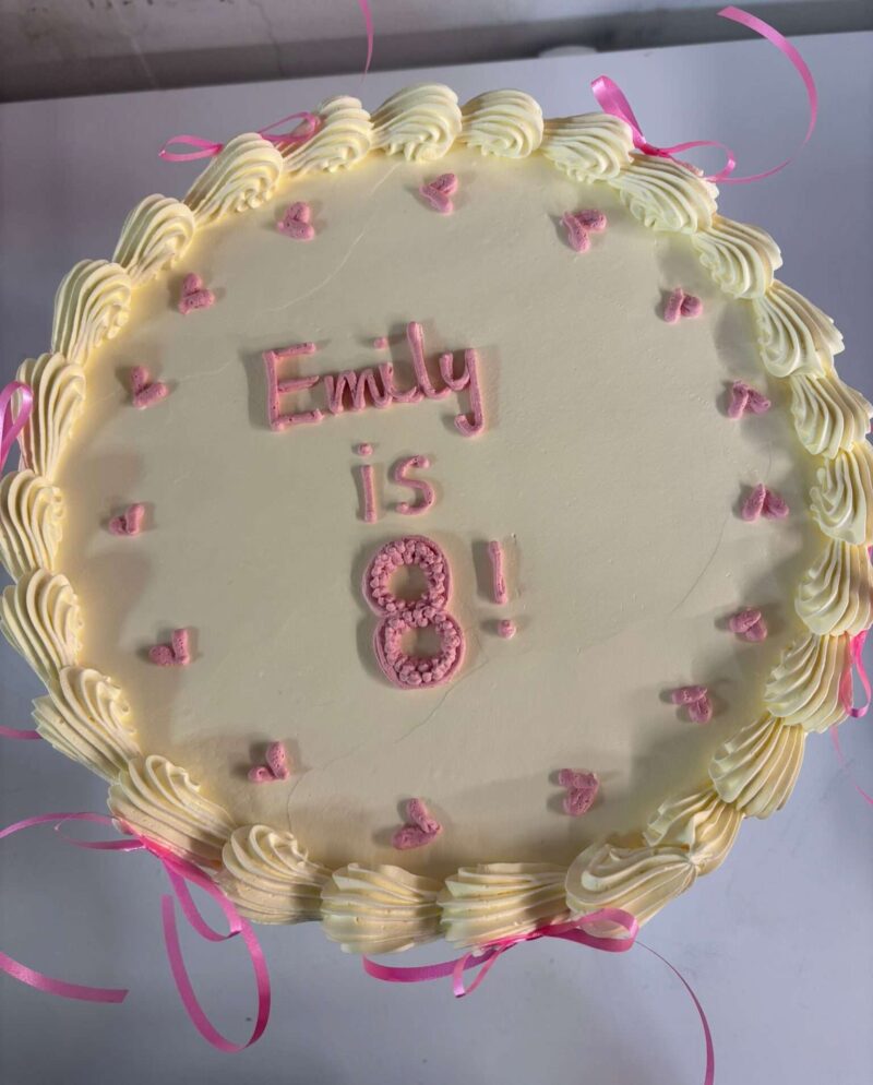 Elegant White Cake with Heart & Bow